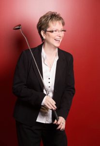 Colleen Gray holding a golf club