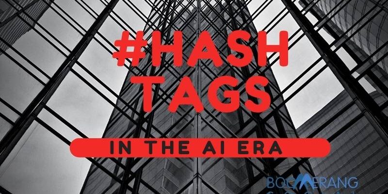 Hashtags in the AI Era written on Black and White skyscrapers - Boomerang Social Marketing